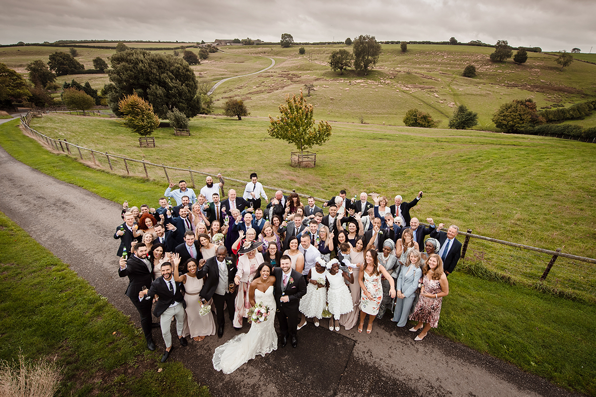 Kingscote Barn wedding venue outdoorGroup Shot